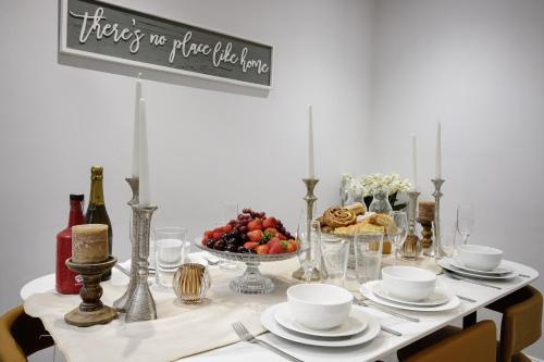 a table with a plate of fruit and a sign at The Place by Sasco in Blackpool