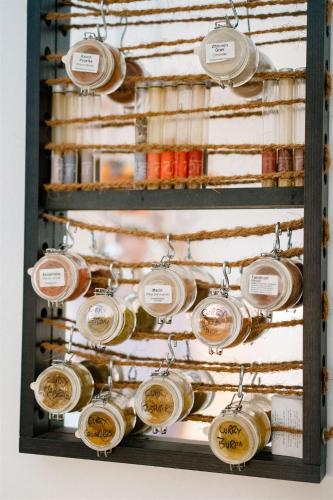 a display of bottles of wine in a display case at in lak'ech - rooms in Chironico