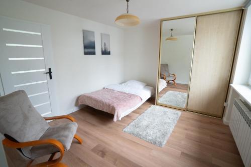 Postel nebo postele na pokoji v ubytování Apartamenty Iława - nad Małym Jeziorakiem
