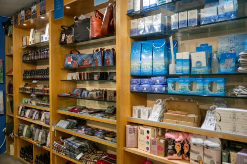 a store shelf filled with lots of products at Loch Ness Drumnadrochit Hotel in Drumnadrochit