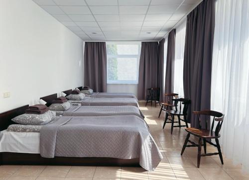 Postel nebo postele na pokoji v ubytování KAUNO JACHTKLUBAS Baltosios Burės