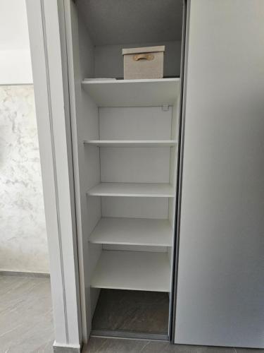 a walk in closet with a box in it at ZEN STUDIO SATURN Sea View in Saturn