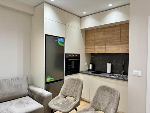 Kuchyň nebo kuchyňský kout v ubytování E&R Apartments at Myslym Shyri
