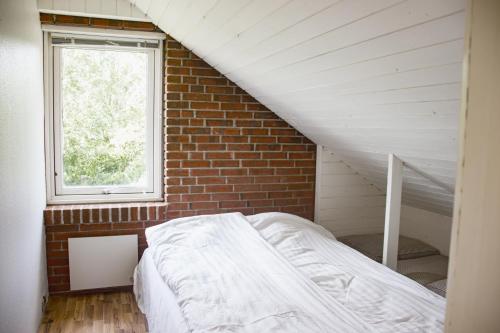 Voodi või voodid majutusasutuse Dejligt og stort hus toas