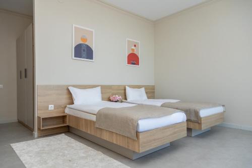 Un ou plusieurs lits dans un hébergement de l'établissement Zhagalau Resort