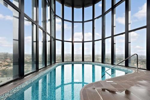 a swimming pool in the middle of a building at Brilliant 2BR Apartment in Belconnen - Hosted by Canstay in Belconnen