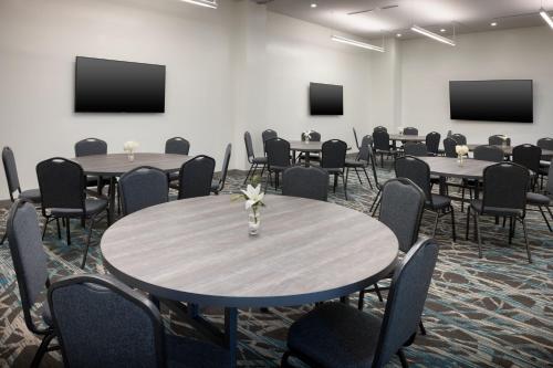 a conference room with tables and chairs and screens at Element Atlanta Buckhead in Atlanta