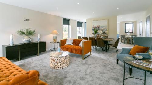 a living room filled with furniture and a dining room at The Nook in Valley