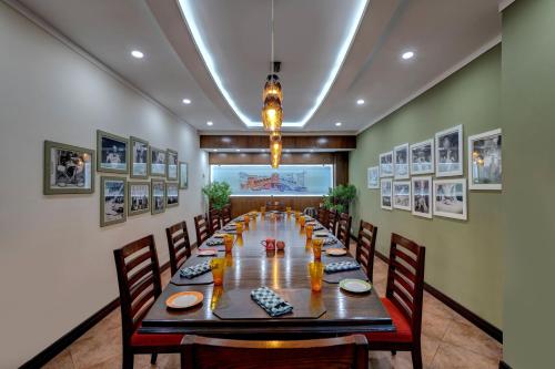 a dining room with a long table and chairs at Islamabad Marriott Hotel in Islamabad