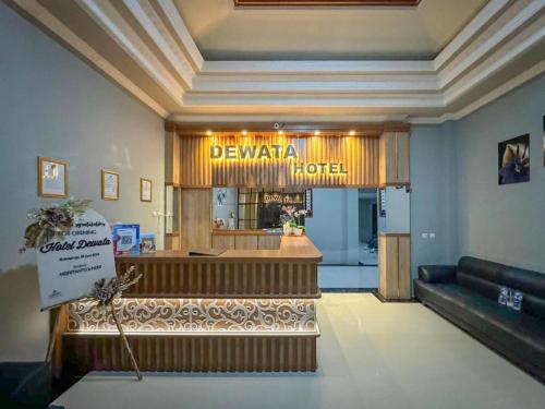 a view of a hotel lobby with a restaurant at Hotel Dewata YIA Kulonprogo in Sindutan