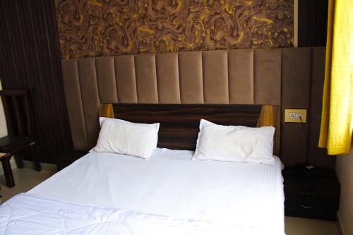 Cama o camas de una habitación en Sangam Hotel