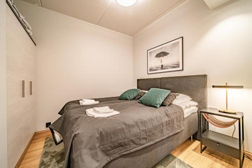 a bedroom with a large bed in a room at Ski Chalet C11 Levi Center incl 2 ski passes by Aavalevi in Levi