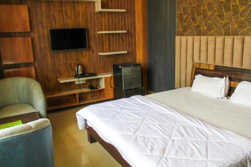 Cama o camas de una habitación en Sangam Hotel