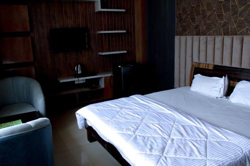 Cama o camas de una habitación en Sangam Hotel