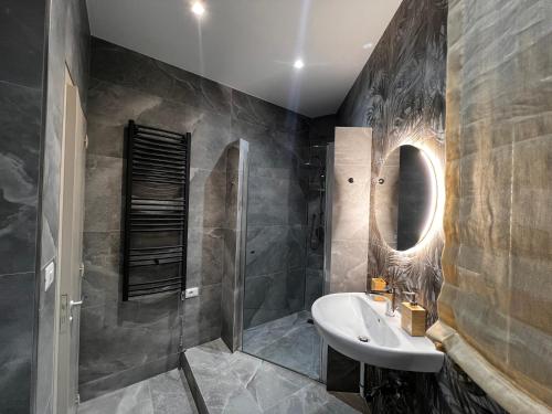 a bathroom with a sink and a mirror at Grandmas holiday home Sicily in Giarre