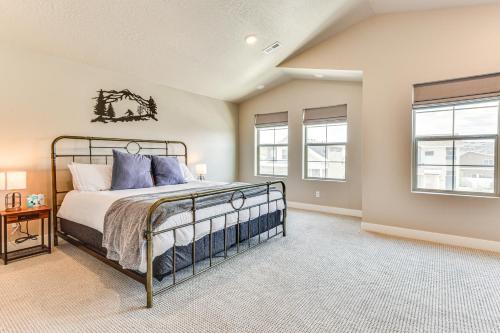 a bedroom with a bed and two windows at Park City Home with Game Room Ski, Mtn Bike and More! in Park City