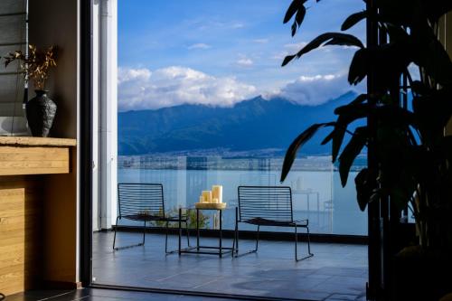 Gambar di galeri bagi 大理石之上Cloud Edge Cabin全视野苍洱半山海景别墅酒店洱海观景店 di Dali