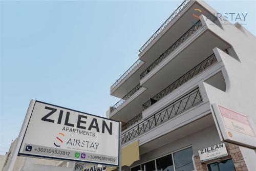 a sign in front of a building at Zilean Apartments Airport by Airstay in Spáta