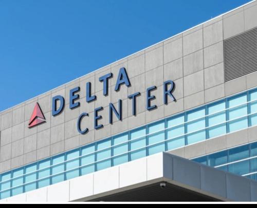 a dealer center sign on top of a building at Delta Center Downtown Retreat in Salt Lake City