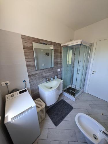 a bathroom with a sink and a toilet and a shower at Relais Vittoria in Castel San Lorenzo