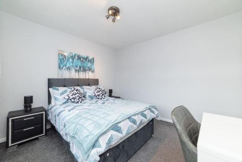 a bedroom with a bed and a chair at Excellent, comfortable location to visit Belfast in Holywood