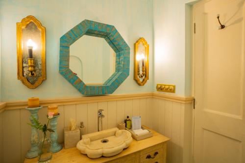 a bathroom with a sink and a mirror on a counter at ELIVAAS 3 BHK with Pvt Pool in Assagao -Montforte Ayada in Assagao