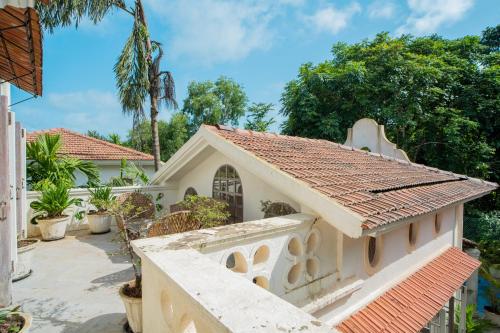 a view of a house with a tile roof at ELIVAAS 3 BHK with Pvt Pool in Assagao -Montforte Ayada in Assagao