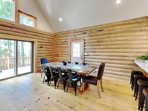 a dining room with a table and chairs at Almost Eden in McHenry