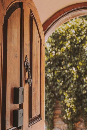 an open wooden door with a metal latch at Cim's Apartments Cerdanya 1 in Bellver de Cerdanya 