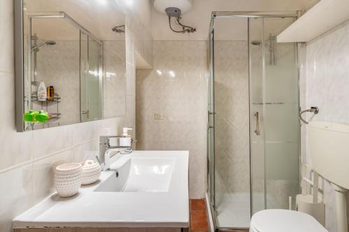 a bathroom with a sink and a shower at Holiday Home Dimora Effe in Castellaneta