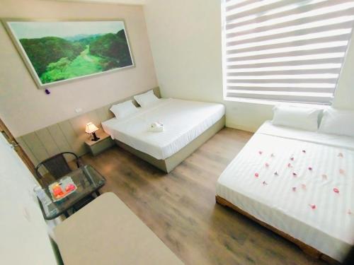 Katil atau katil-katil dalam bilik di THUY DUNG TAM COC HOMESTAY