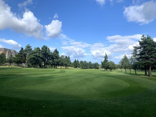 a view of a golf course with a green at 16 Knightsridge House in Livingston