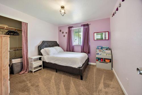a bedroom with a bed and pink walls at Lanka Rose House by WanderLodges in Phoenix
