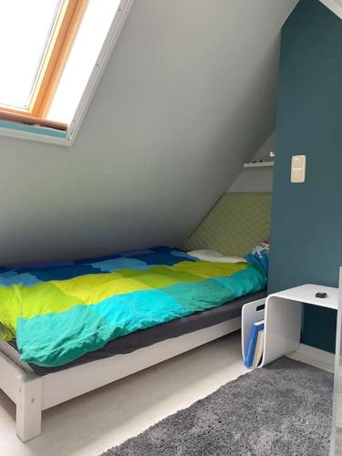 Ένα ή περισσότερα κρεβάτια σε δωμάτιο στο Ferienhaus im Thüringer Wald