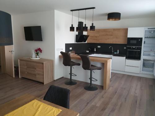 Kuchyň nebo kuchyňský kout v ubytování Nový Apartmán v areálu Wellness hotelu Frymburk