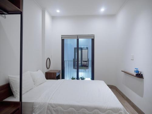 Ένα ή περισσότερα κρεβάτια σε δωμάτιο στο Amber Hotel