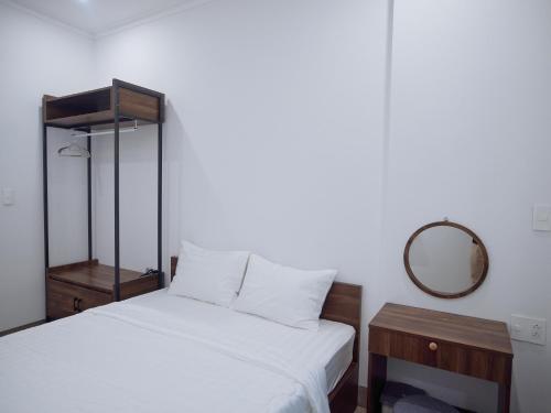Ένα ή περισσότερα κρεβάτια σε δωμάτιο στο Amber Hotel