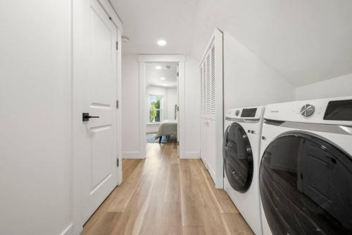 a white laundry room with a washer and dryer at 10Guests! Parking 2ND FLOOR-Duplex in Fair Lawn