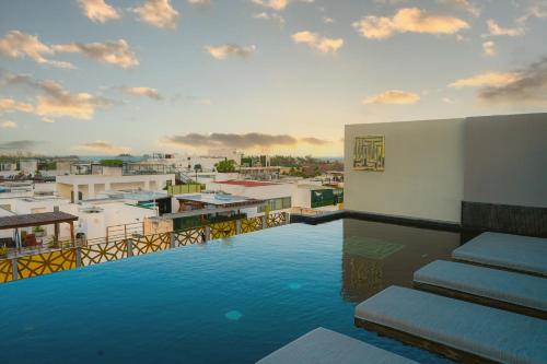 a swimming pool on the roof of a building at IT Boutique Hotel & Restaurant in Playa del Carmen