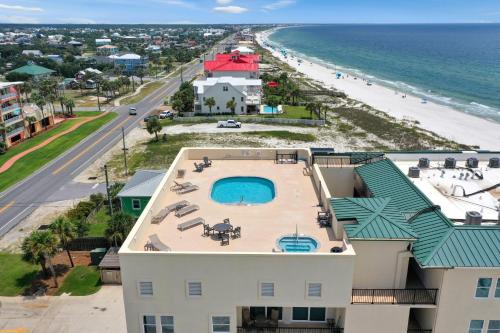 an aerial view of a resort with a pool and the beach at Hatchling Hideaway by Pristine Property Vacation Rentals in Indian Pass