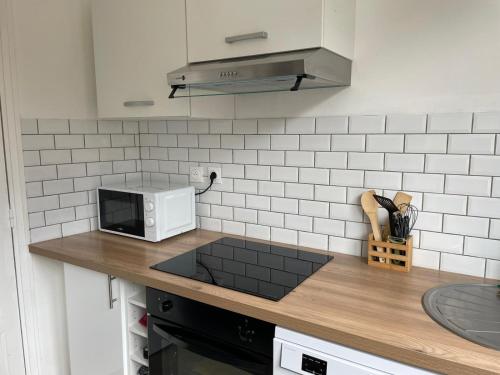 Kuchyň nebo kuchyňský kout v ubytování Appartements Turquoise 2 pers - L'Artdu'Net -