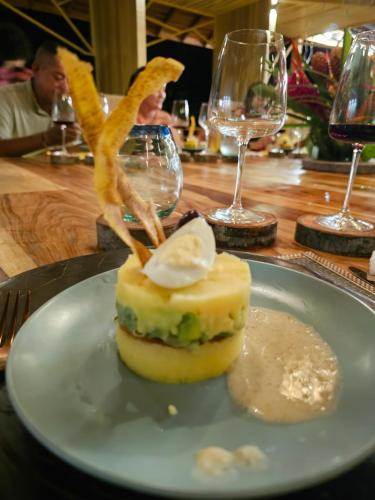 a piece of food on a plate on a table at Burú Nature Hotel in Leticia