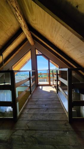 a wooden bridge with a view of the ocean at Cabañas El Marqués Zacatlán con Starlink in Zacatlán