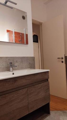 a bathroom with a sink and a mirror at A casa di Sara in Recanati