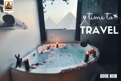 a jacuzzi tub in a room with a window at Pyramids Paradise icon in Cairo