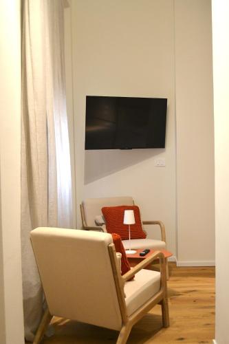 TV a/nebo společenská místnost v ubytování Everyday Apartments Corte Petroni
