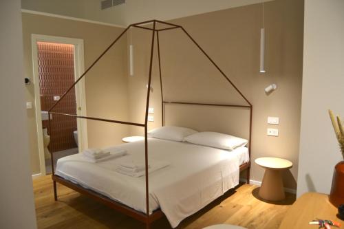 Postel nebo postele na pokoji v ubytování Everyday Apartments Corte Petroni