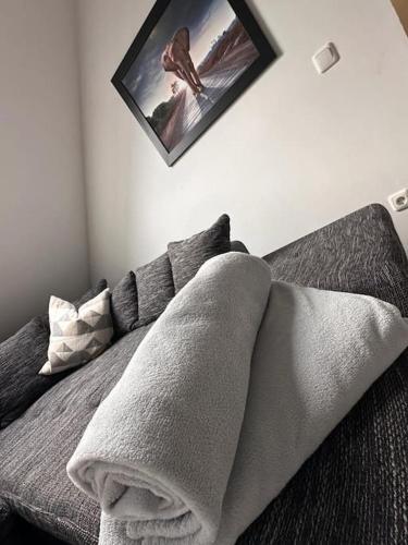 a bedroom with a bed with two pillows on it at Panoramablick in Litzendorf in Litzendorf