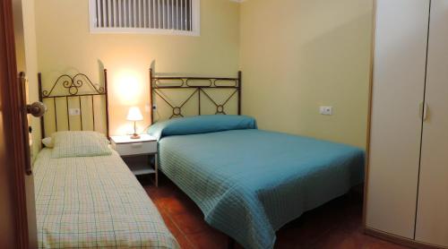 En eller flere senge i et værelse på Casa Rural Las Provincias