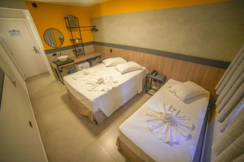 En eller flere senge i et værelse på Hotel Coroados Foz Express